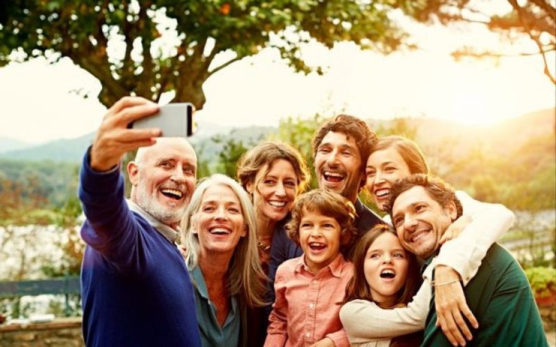 Cheerful family taking selfie