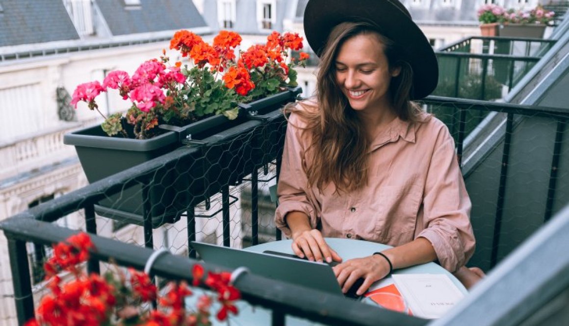 woman-wearing-beige-dress-shirt-using-laptop-computer-3277932